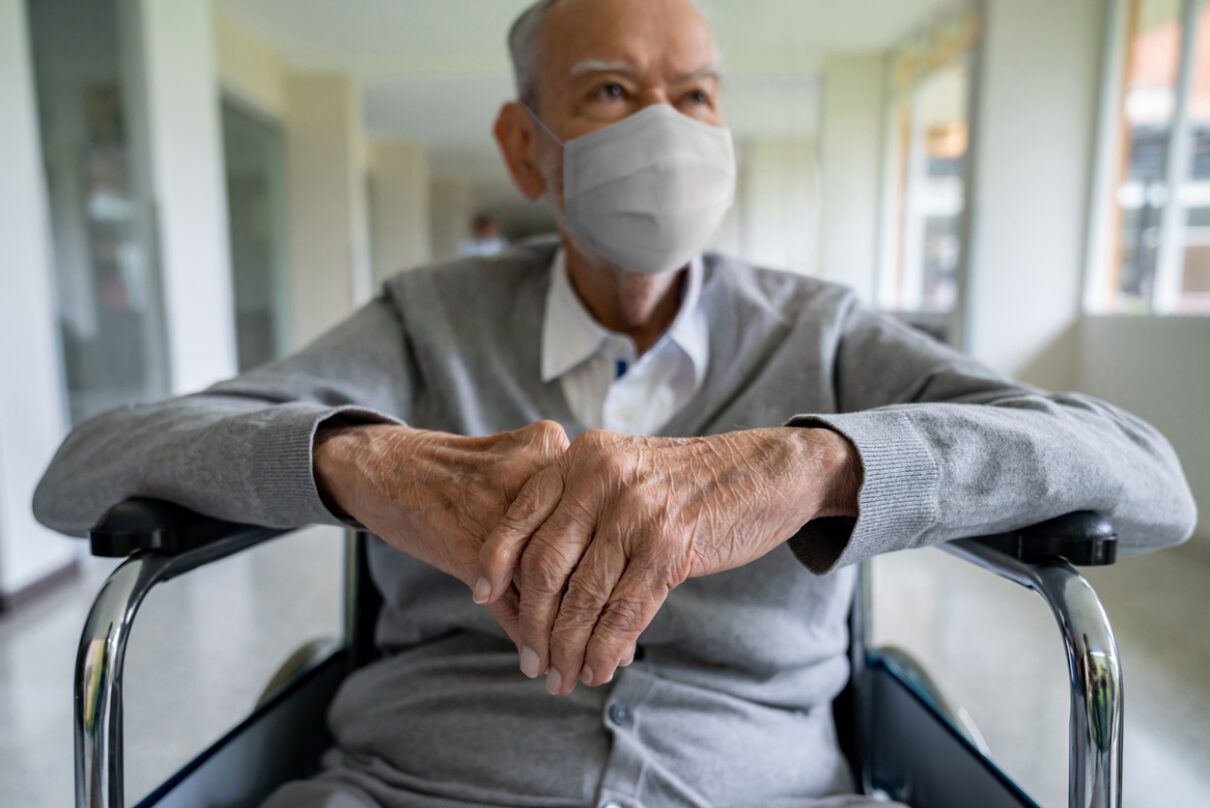a senior man in a wheelchair taking legal action to protect his medial rights.