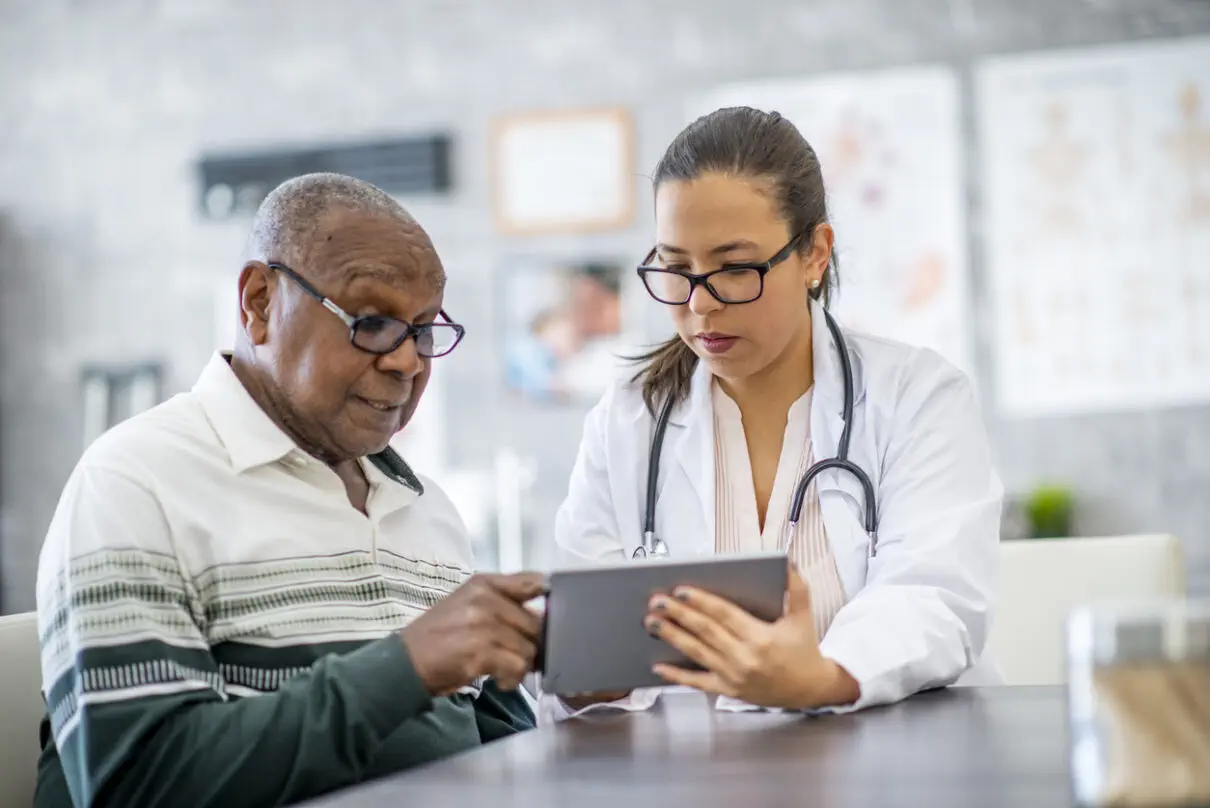 a senior man having his medical test results explained by a doctor